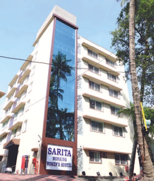The Sarita Working Women’s Hostel building in Andheri West, with its blue-glass frontage and entrance sign