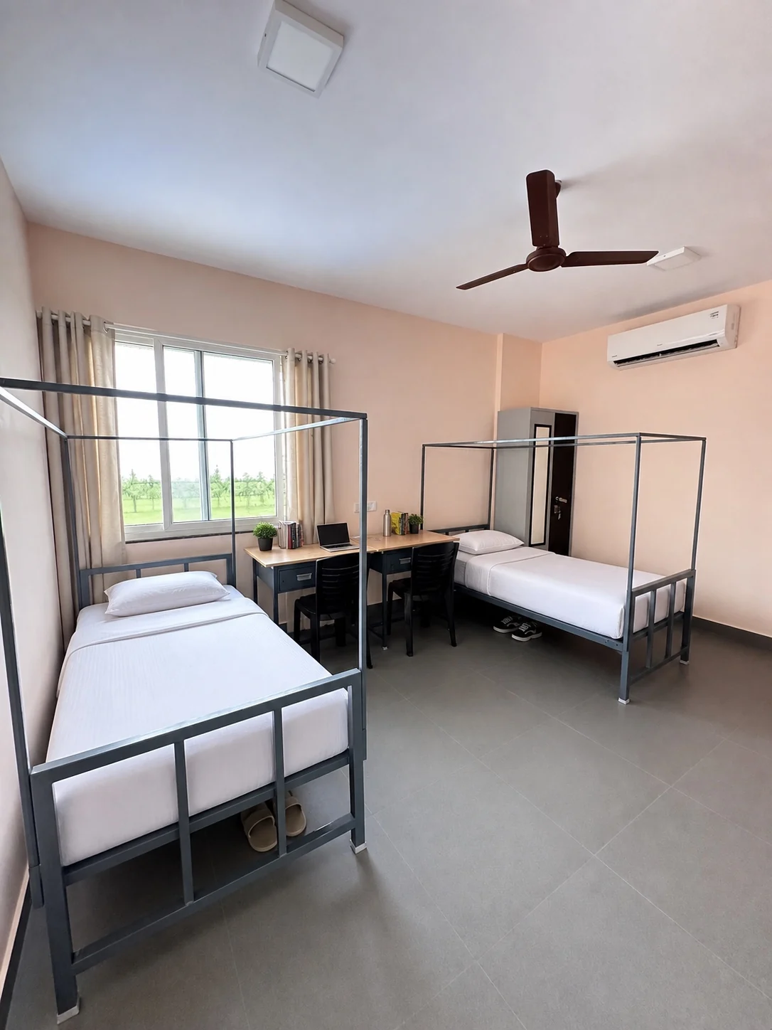 Double sharing room with two beds and window