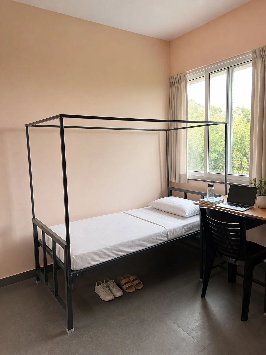 Furnished bed and study desk in a double sharing room