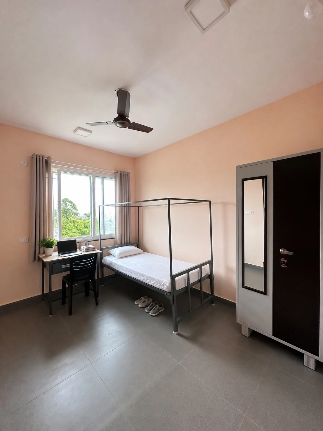 Double sharing room with beds, desks and wardrobe