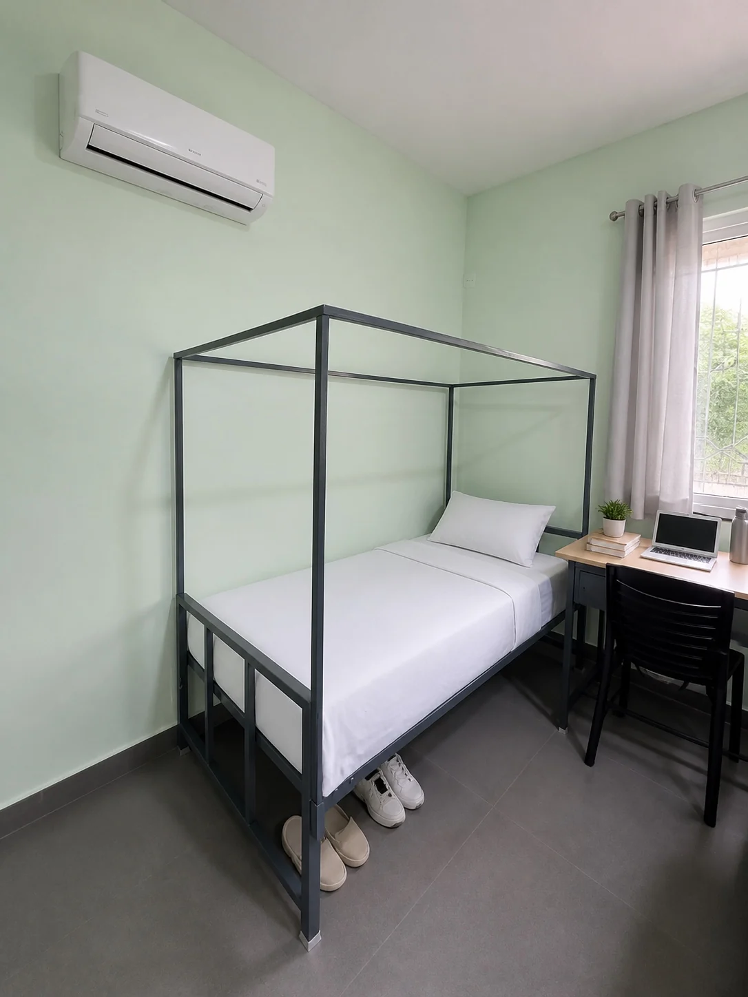 Bed and study desk in a triple sharing room