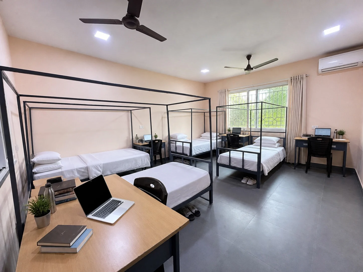 Furnished quad sharing room at Sarita Working Women’s Hostel