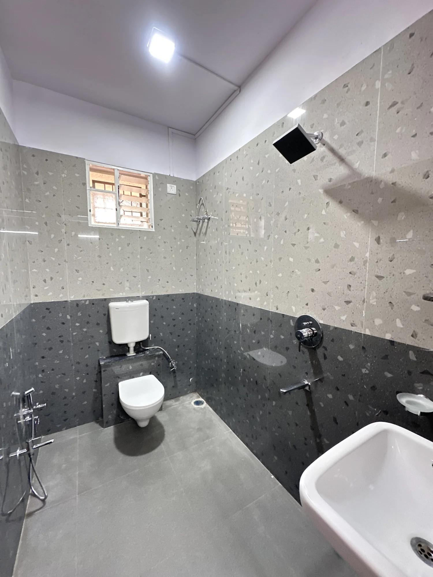Clean shared bathroom with modern fittings