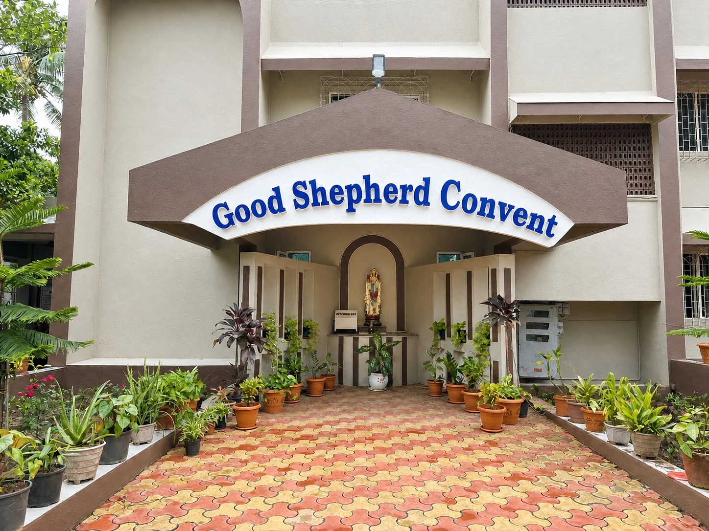 Good Shepherd Convent entrance and grotto chapel during the day